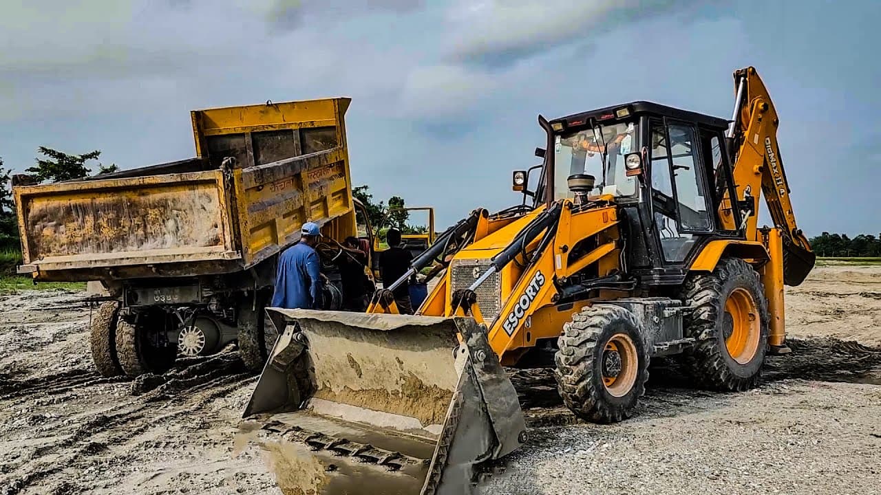Tipper truck being loaded with aggregates at a material yard